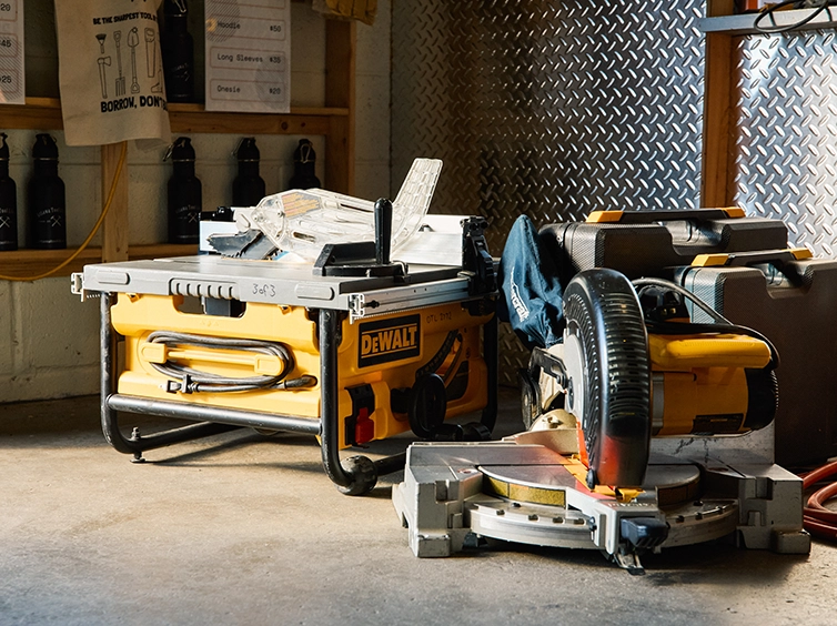 Table saw and mitre saw on floor